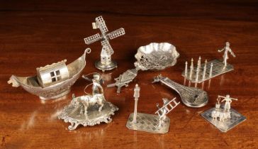 A Group of Eight Silver Miniature Ornaments, mainly Dutch.