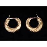 A Pair of 18 Carat Yellow Gold Hoop-earrings designed in London by the house of Kutchinsky,