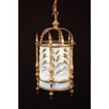 An Attractive Early 20th Century Brass Hall Lantern with a cylindrical glass shade swathed with