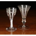 A Trumpet Bowled Wine Goblet engraved with a border of scrolling foliage on a baluster knopped stem