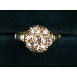 A Victorian Gold ring set with Seven large Diamonds, totalling approx 1.5 carat.