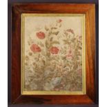 A Fine Framed 19th Century Needlework Panel depicting flowering plants with a bird perched upon an