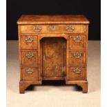 An Early 18th Century Walnut Kneehole Desk.