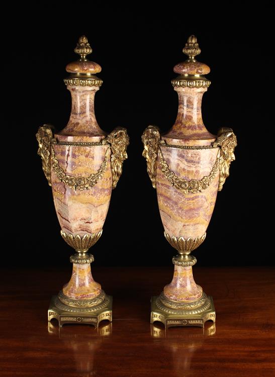 A Pair of Attractive Late 19th Century Marble Cassolettes with gilt metal mounts.