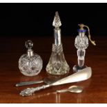 Three Silver Mounted Cut Glass Scent Bottles, a silver handled shoe horn,