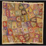 An Antique Crazy Patchwork Panel composed of asymmetric coloured patches backed onto muslin;