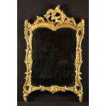 A Carved Rococo Giltwood Mirror.