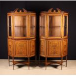 A Pair of Edwardian Sheraton Revival Inlaid Satinwood Display Cabinets of canted form.