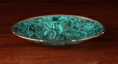 A Malachite Dish of oval form with gilded rim, 7¼" x 4¾" (18.5 cm x 12 cm).