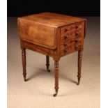 A George IV Mahogany Work Table inlaid with ebony bands.