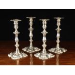 A Set of Four Late Victorian Silver Candlesticks by William Hutton & Sons Ltd,