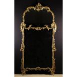 A Large Louis XV Style Carved & Gessoed Giltwood Overmantel Mirror.