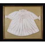 A Child's 19th Century White Cotton Smock embroidered with ecru coloured S-scroll decoration and