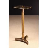 A Regency Japanned Candle Stand.