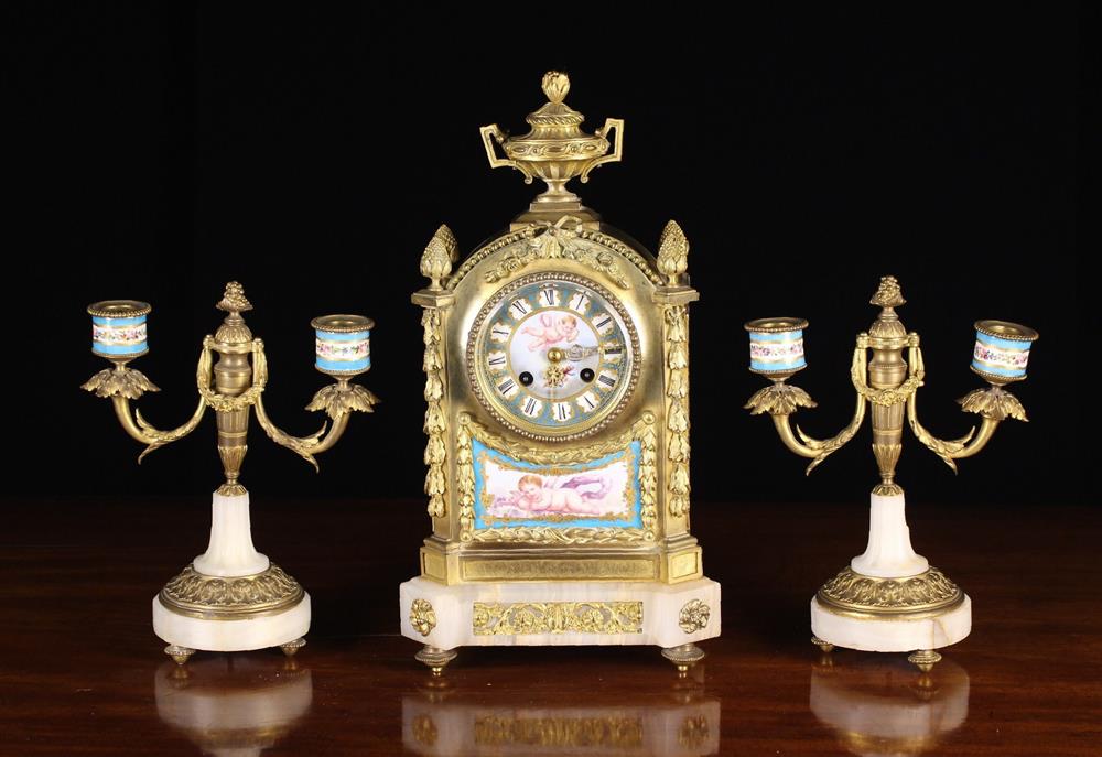 A 19th Century French Porcelain, Ormolu & Onyx Marble Clock Garniture Set in the Louis XVI Style.
