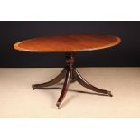 A Regency Style Tilt-top Oval Breakfast Table by White Furniture Ltd Chesterfield.