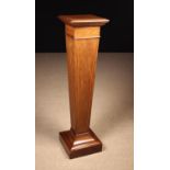 An Edwardian Mahogany Pedestal inlaid with cross-banding edged with stringing.