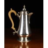 A Silver Lidded Baluster Hot-Water Jug on a raised foot with scroll crested wooden handle,