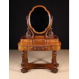 A Victorian Figured Walnut Dressing Table.