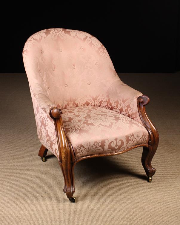 A Victorian Upholstered Walnut Tub Armchair.