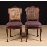 A Pair of 19th Century Caned Side Chairs in the Louis XV style.