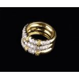 An 18 Carat Yellow Gold & Diamond Triple Band Ring attributed to Kutchinsky.
