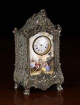 A 19th Century Viennese Enamelled Miniature Clock in an ornate white metal case relief cast with