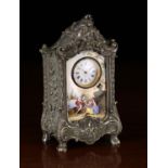 A 19th Century Viennese Enamelled Miniature Clock in an ornate white metal case relief cast with