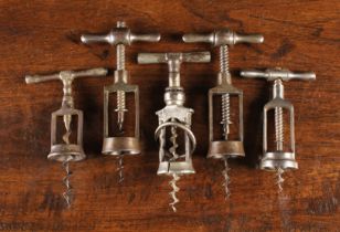 Five Framed Antique Steel Corkscrews to include a German made 'Monopol' with a threaded wing-nut
