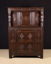 A Small 17th Century Carved Oak Court Cupboard.