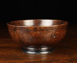 An 18th Century Turned Burr-wood Footed Bowl 3½" (9 cm) high, 7¾" (19.5 cm) in diameter.