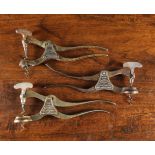 Three Two Piece Lund's Lever Corkscrews with triangular plaques to the pivots;
