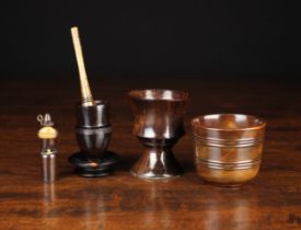 A Turned Lignum Vitae Dipper Cup with decorative bands of turned reeding and an inset George III