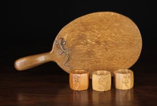 A Vintage Oak Cheese Board and Three Napkin Rings by Derek 'Lizardman' Slater of Crayke Yorkshire;