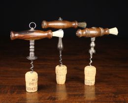 Three 19th Century Straight-pull Corkscrews having turned wooden handles with dusting brushes: One