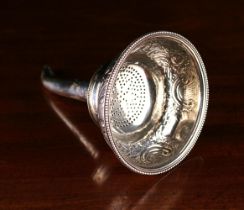 A George III Silver Three-part Wine Funnel with sieve, removable muslin ring and tapered spout.