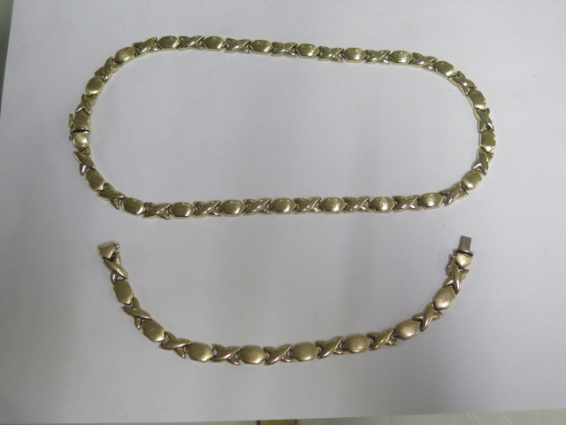 A 9ct yellow gold necklace and bracelet set - necklace 44cm and bracelet 18cm long - total weight