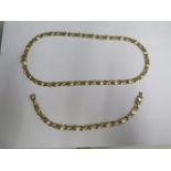 A 9ct yellow gold necklace and bracelet set - necklace 44cm and bracelet 18cm long - total weight