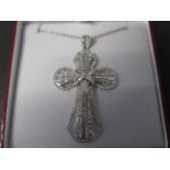 An 18ct white gold designer cross approx 2.75ct of diamonds, carat weight marked to the suspension