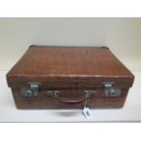 A vintage Drew and Sons of London crocodile skin suitcase - with some old repairs, in polished
