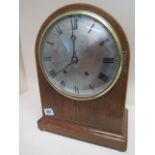 A late 19th century oak case bracket clock with quarter chiming and hour strike on five gongs with