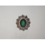 An 18ct yellow gold emerald and diamond cluster ring, head size approx 19mm x 17mm, emerald approx