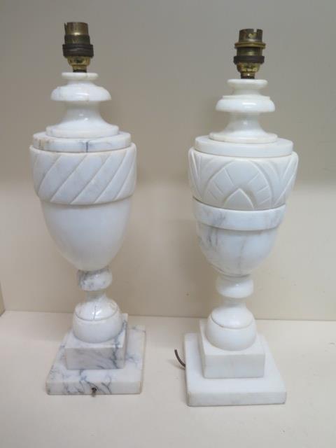 A near pair of white marble table lamps - Height 43cm - one damage to base, will need rewiring