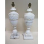 A near pair of white marble table lamps - Height 43cm - one damage to base, will need rewiring