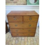 A 19th century two part five drawer campaign chest missing feet and some loss to front but a good