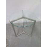 A chrome and glass circular side table - Height 61cm x 50cm