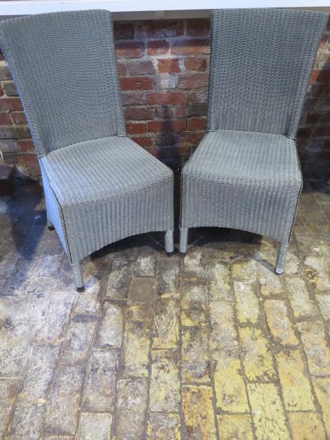 A pair of modern Lloyd Loom Neptune Havana side chairs - Height 95cm some usage wear - retail