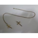 A 18ct yellow gold crucifix on a 78cm no clasp chain - approx weight 7.7 grams - and a 9ct