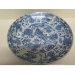 An Oriental blue and white charger bowl decorated with a bird and foliage - Diameter 37cm - good