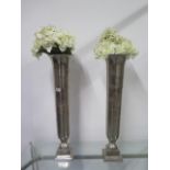 A pair of Libra metallic vases - Height 74cm with foliage